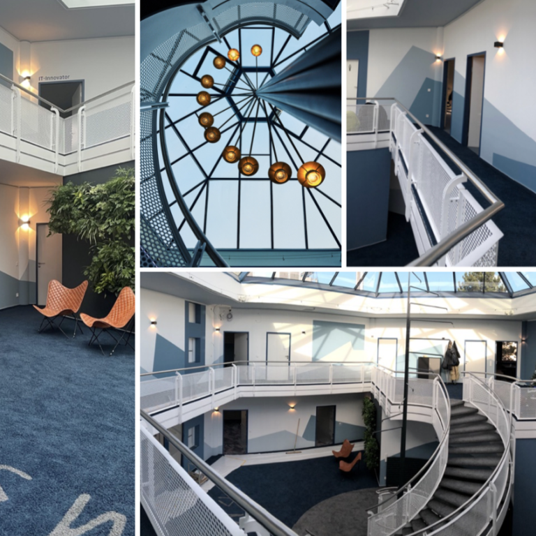 Moderne Innenarchitektur mit spiralförmiger Treppe, Sitzbereichen und Lichtern.