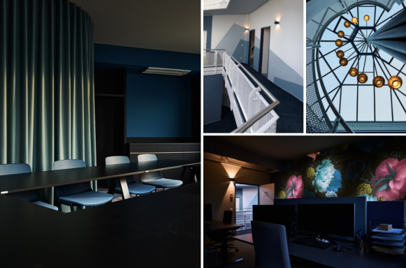 Moderner Innenraum mit blauen Wänden, eleganten Möbeln und kreativen Lichtinstallationen.